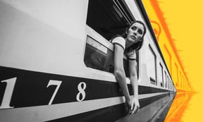 Woman leaning out the window on a train